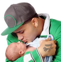 Young father holding his baby close